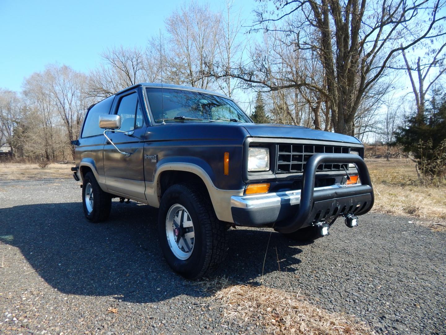 1988 Blue /Tan Ford Bronco II 4WD (1FMCU14T6JU) with an 2.9L V6 OHV 12V engine, 4-Speed Automatic Overdrive transmission, located at 6528 Lower York Road, New Hope, PA, 18938, (215) 862-9555, 40.358707, -74.977882 - Here we have a 1988 Ford Bronco 2 with a 2.9L V6 putting power to a 4x4 automatic transmission. Options include: tan cloth interior, heat/AC, XD Vision radio, power windows, cruise control, tilt steering wheel, front/rear defrost windows, spare tire cover, 15 inch alloy wheels with 4 Solarus AP tire - Photo#19